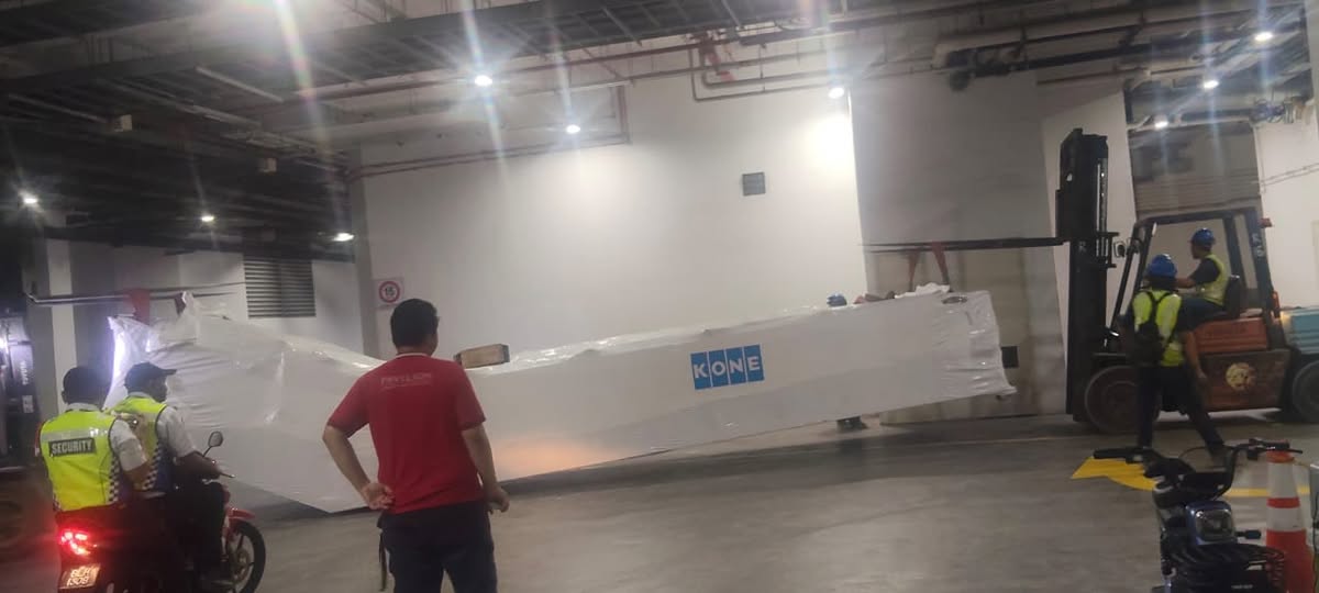 Escalator equipment being moved into position at a project site